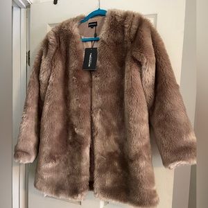 This beautiful faux fur jacket is from Pretty Little Things, size 6 light brown.